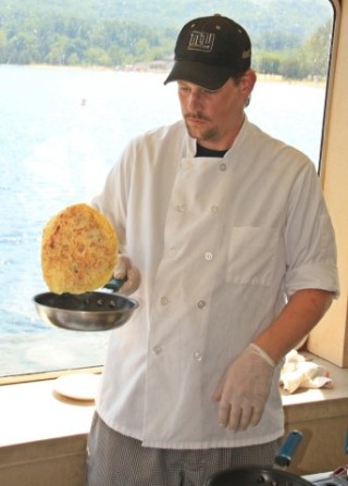 Flipping omlets on the Saint's Brunch trip