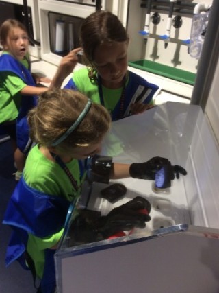Astronauts test materials during a mission in the Challenger Learning Center